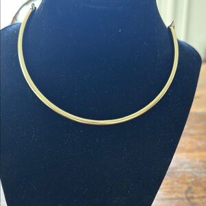 Gold choker necklace.